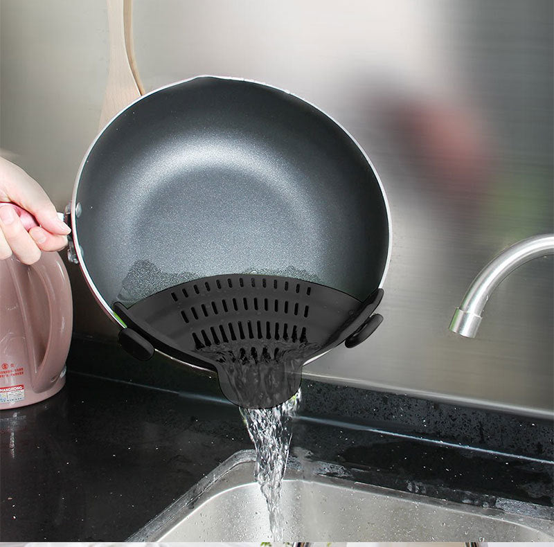 Black Adjustable Silicone Pot Strainer in use