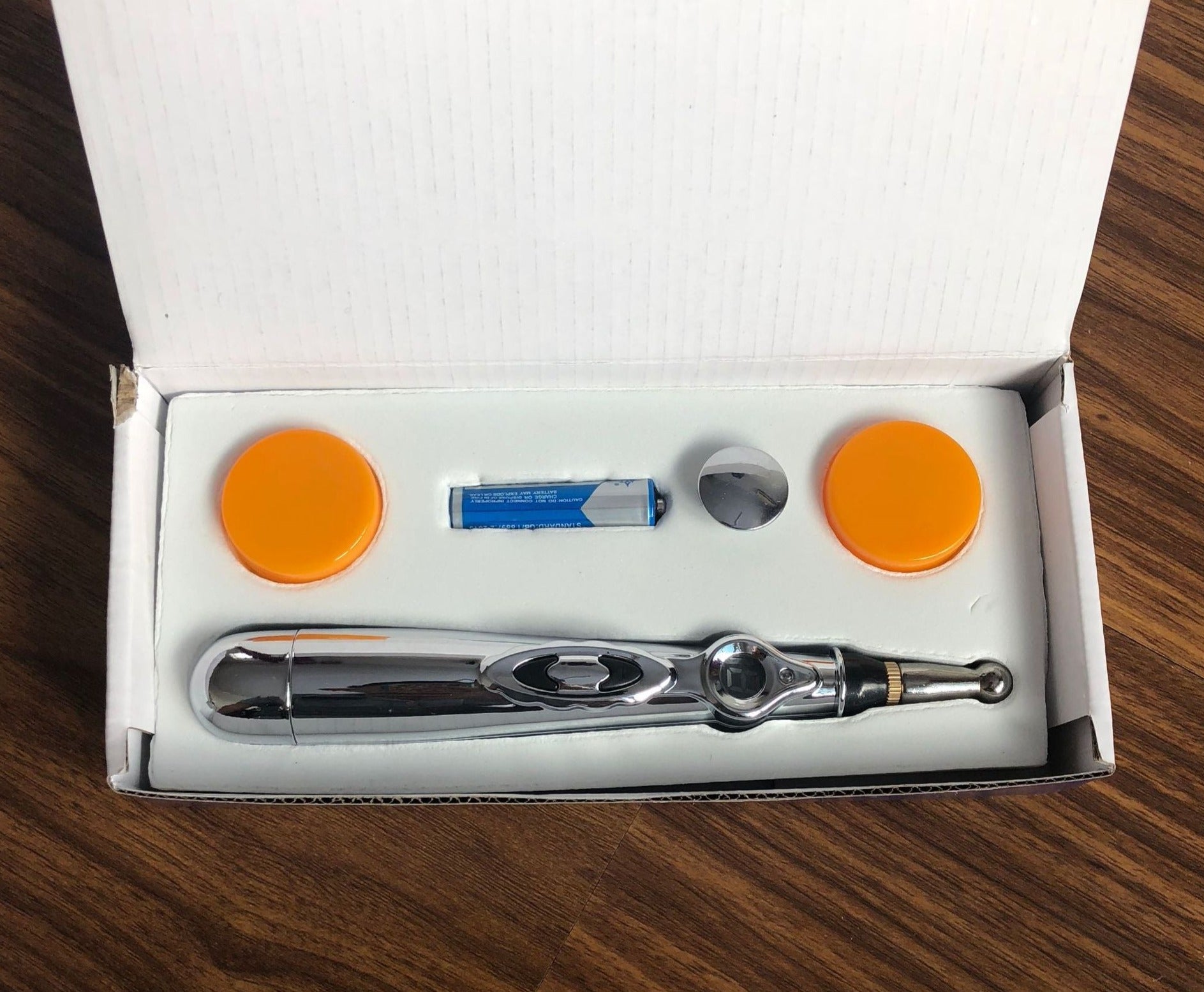 Acupuncture Massage Pen with opened packaging